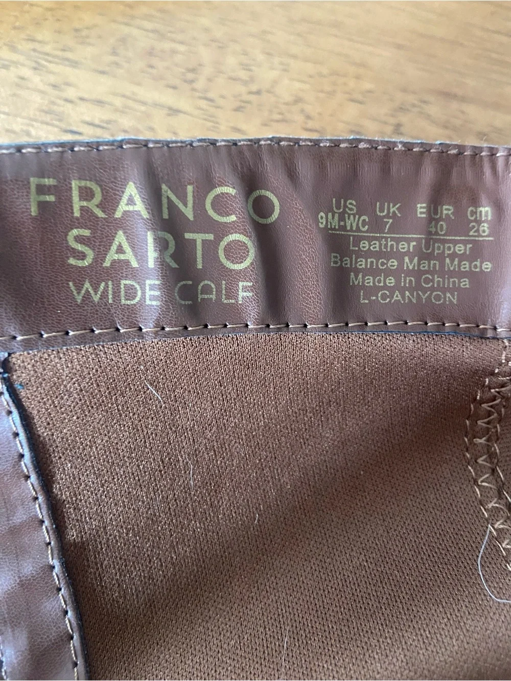 Franco Sarto Black and Brown Over-the-Knee Leather Boots.
